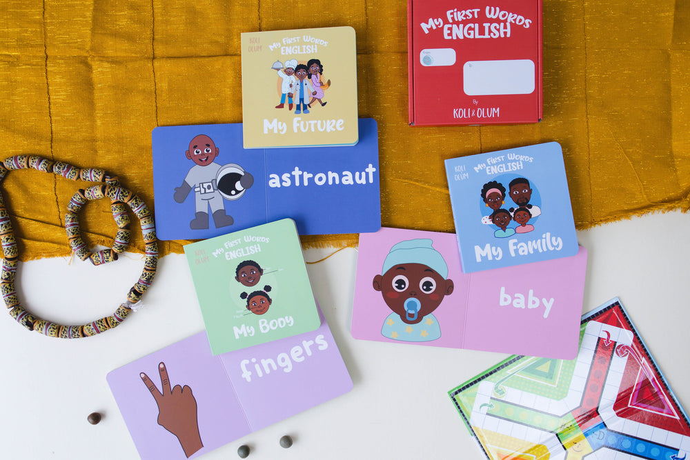 Open board books showing words like fingers, baby and astronaut